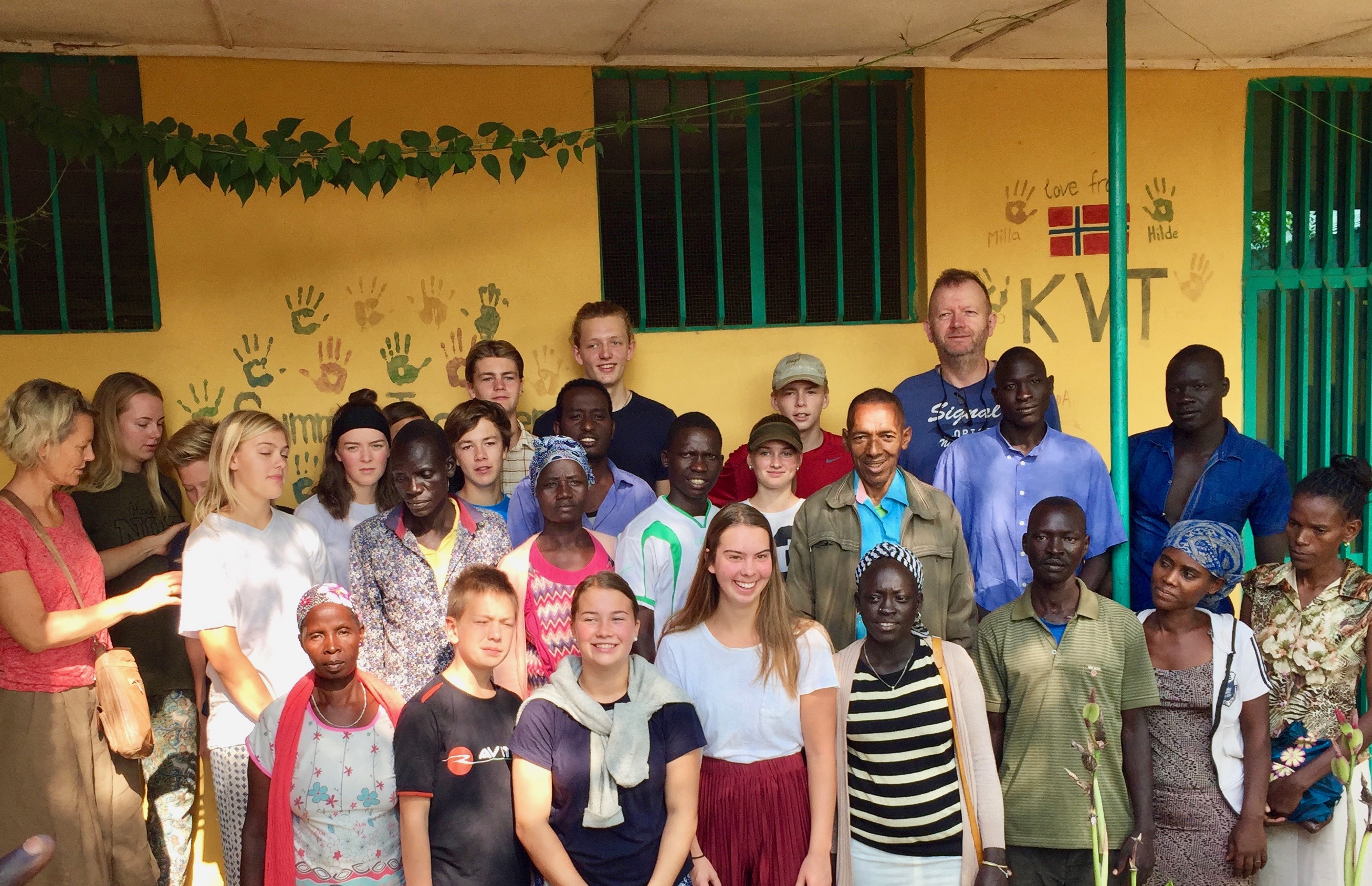 A group of people posing for a photoAI-generated content may be incorrect.